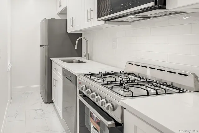 a kitchen with a stove and a microwave