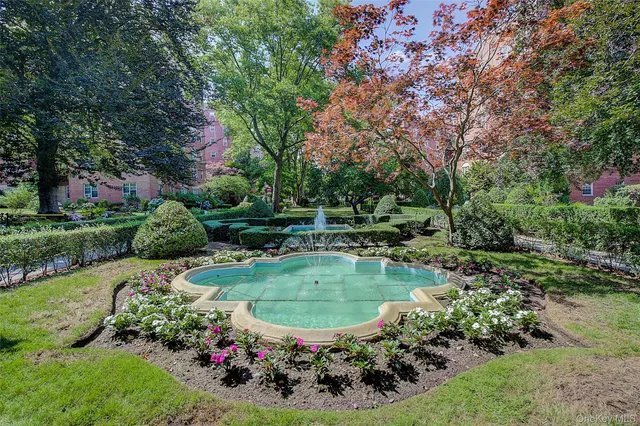 a view of a swimming pool with a yard