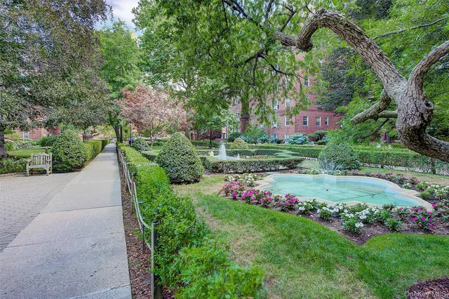 a view of a patio with a table and chairs and potted plants