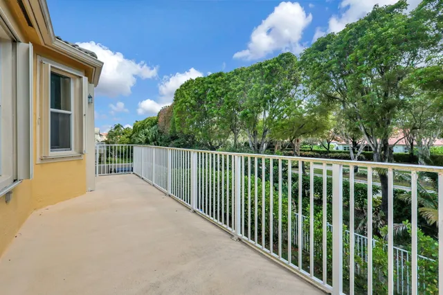 a balcony with yard in back