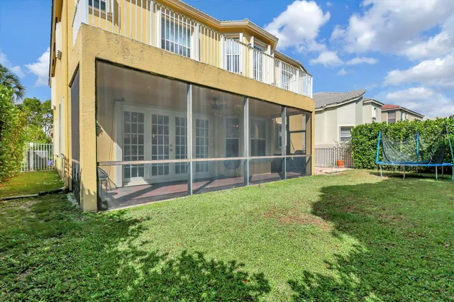 a view of an apartment with a backyard