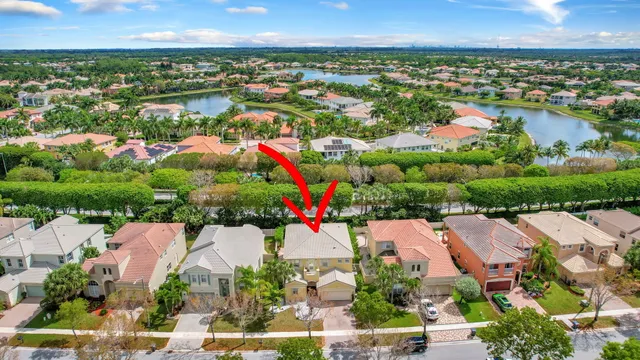 an aerial view of residential houses with outdoor space and street view