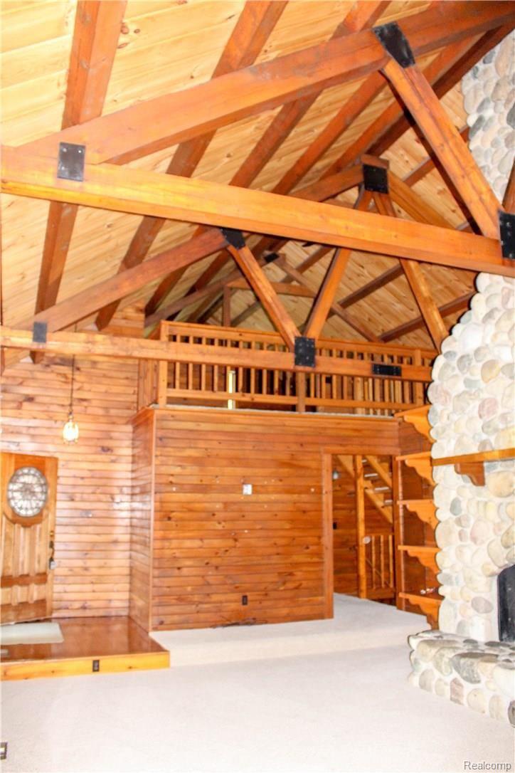 4165 Morgan Road Lake Orion, MI 48359 - Photo 23 of 81 Family Room Entry has vaulted ceilings and an incredible natural fieldstone fireplace that is a showcase piece.