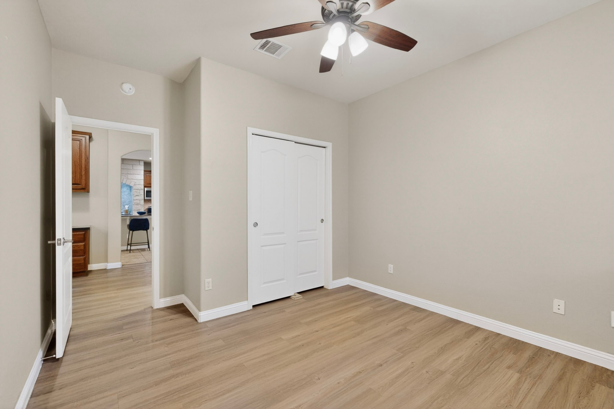 178 Limestone Trail Austin, TX 78737 - Photo 32 of 40 Room featuring neutral wall tones, wood-finish flooring, and white baseboards