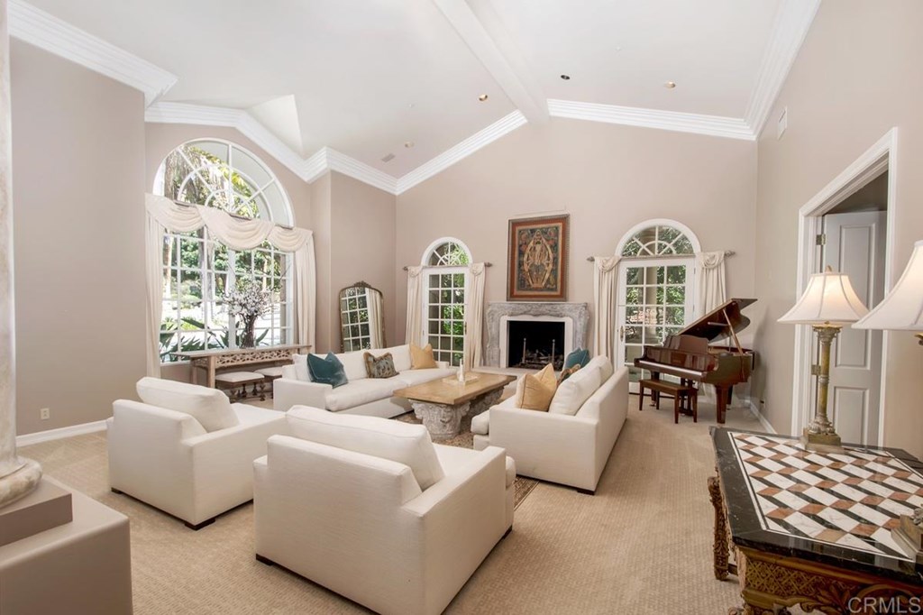 17101 Circa Oriente Rancho Santa Fe, CA 92067 - Photo 11 of 23 a living room with fireplace furniture and a large window