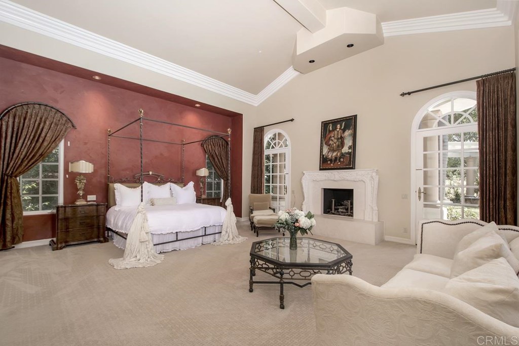 17101 Circa Oriente Rancho Santa Fe, CA 92067 - Photo 18 of 23 a living room with furniture fireplace and window
