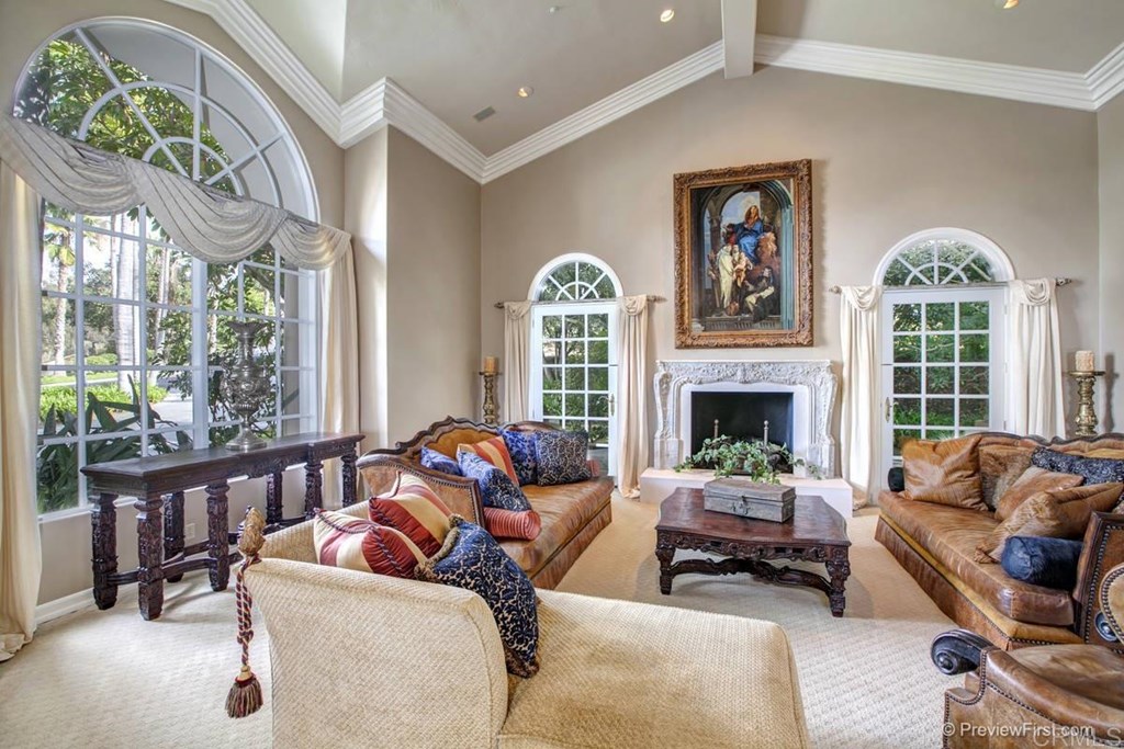17101 Circa Oriente Rancho Santa Fe, CA 92067 - Photo 5 of 23 a living room with furniture fireplace and a large window