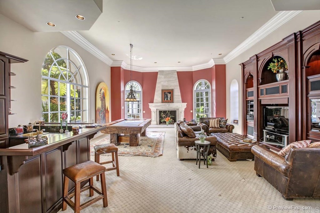 17101 Circa Oriente Rancho Santa Fe, CA 92067 - Photo 8 of 23 a living room with fireplace furniture and a large window