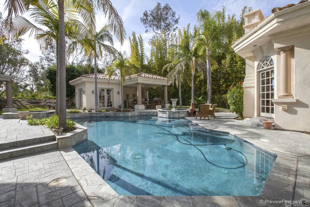 17101 Circa Oriente Rancho Santa Fe, CA 92067 - Photo 9 of 23 a view of a house with swimming pool and sitting area