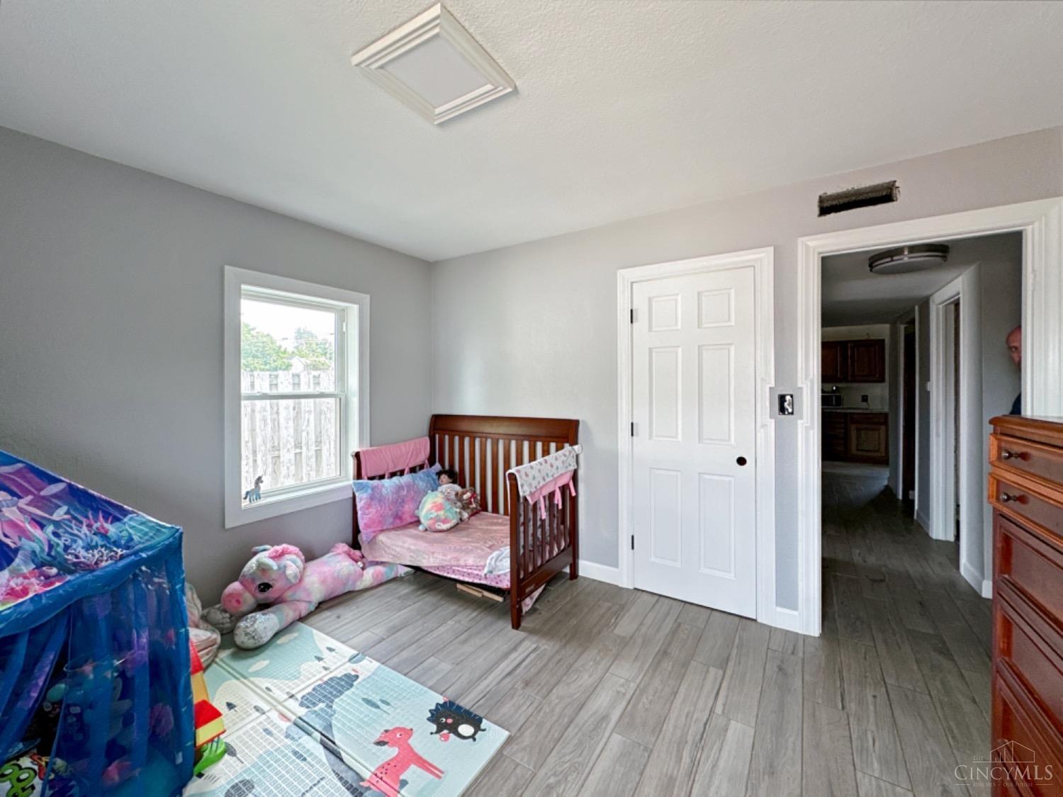 1519 Flemming Road Middletown, OH 45042 - Photo 10 of 25 Spacious bedroom with tile plank flooring, wide baseboards and trim packaged professionally installed.