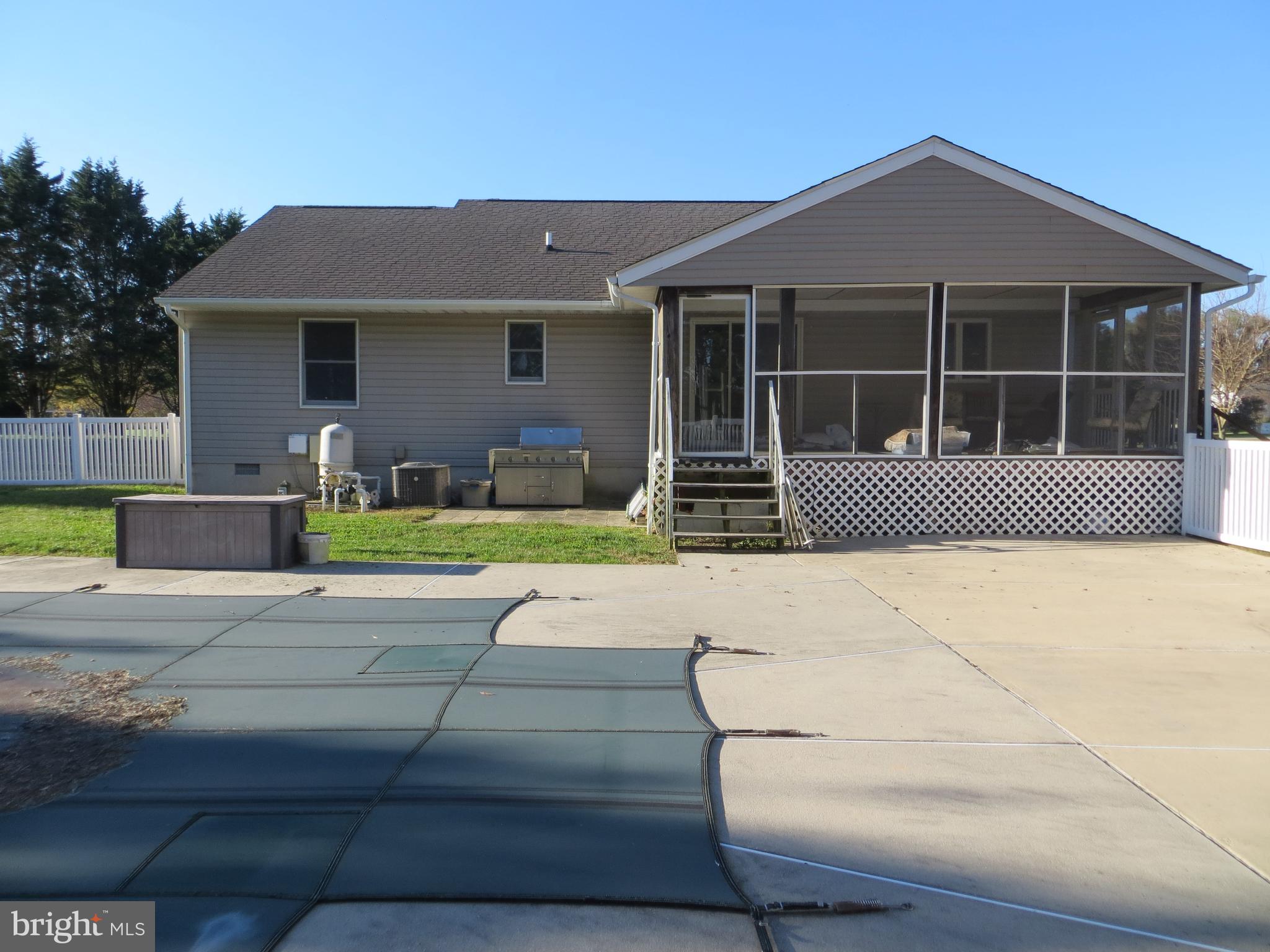 11498 Reed Circle Ridgely, MD 21660 - Photo 2 of 4 back of home w/ concrete pool