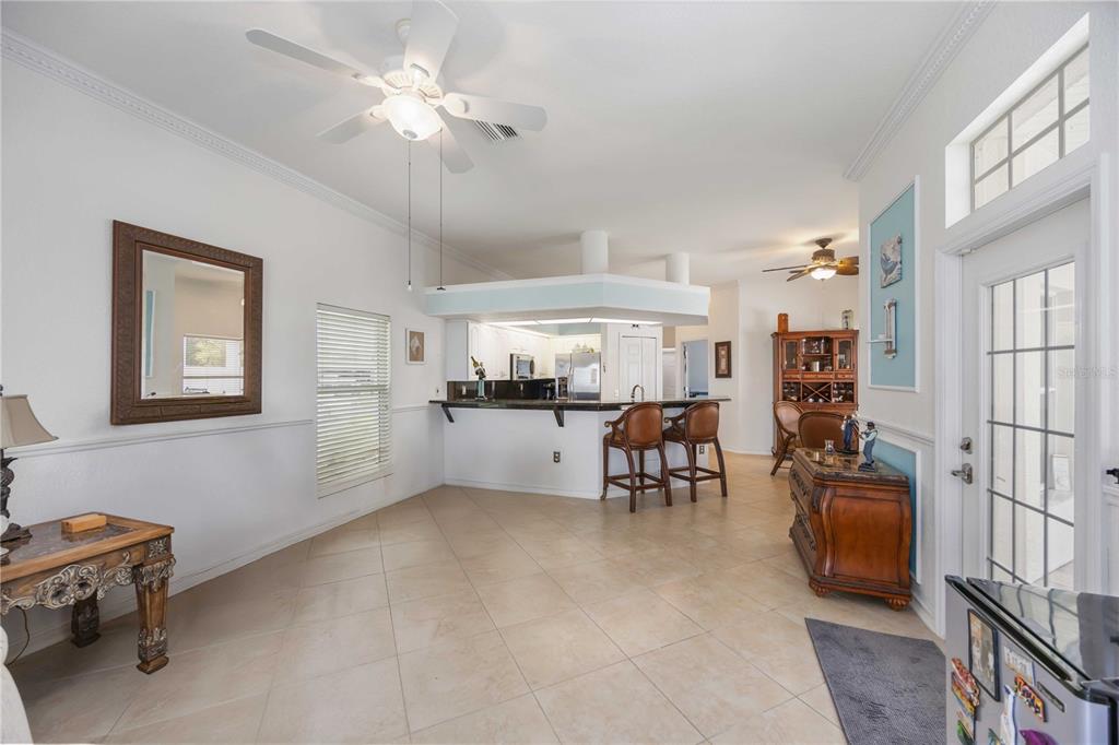 48 Bunker Road Rotonda West, FL 33947 - Photo 17 of 59 a living room with furniture and kitchen view