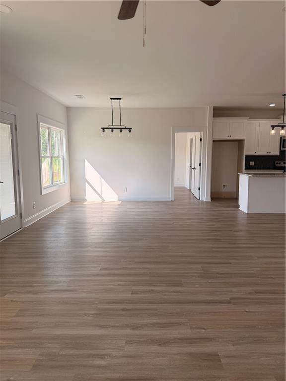 7213 King Road Valley, AL 36854 - Photo 4 of 20 Open concept living area featuring wood-finish flooring, white walls, and recessed lighting
