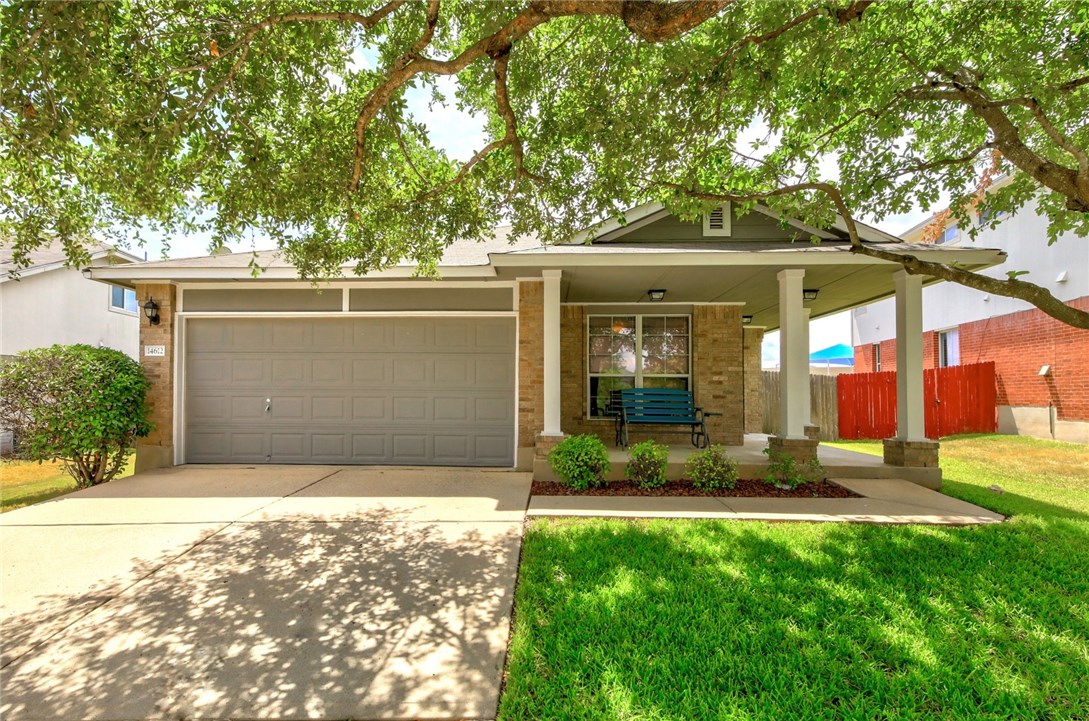 14612 Hyson Crossing Pflugerville, TX 78660 - Photo 1 of 1 a view of a big house with palm tree in front of it