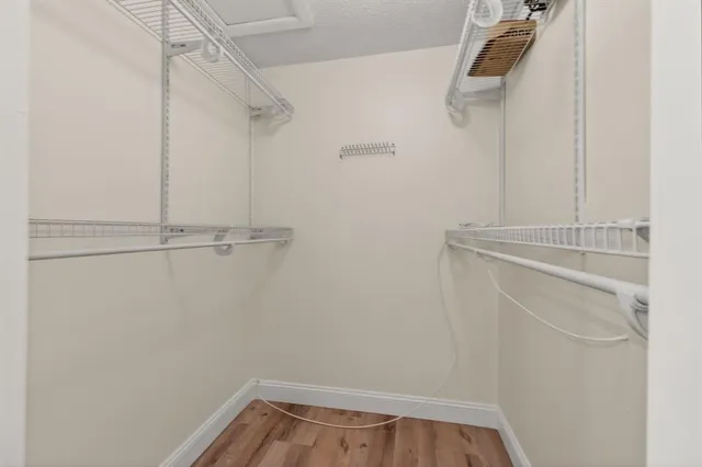 a bathroom with a toilet a sink and a mirror