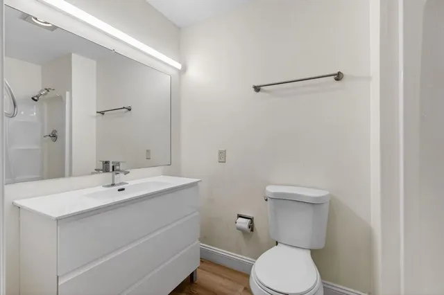 a view of a backyard with a tree