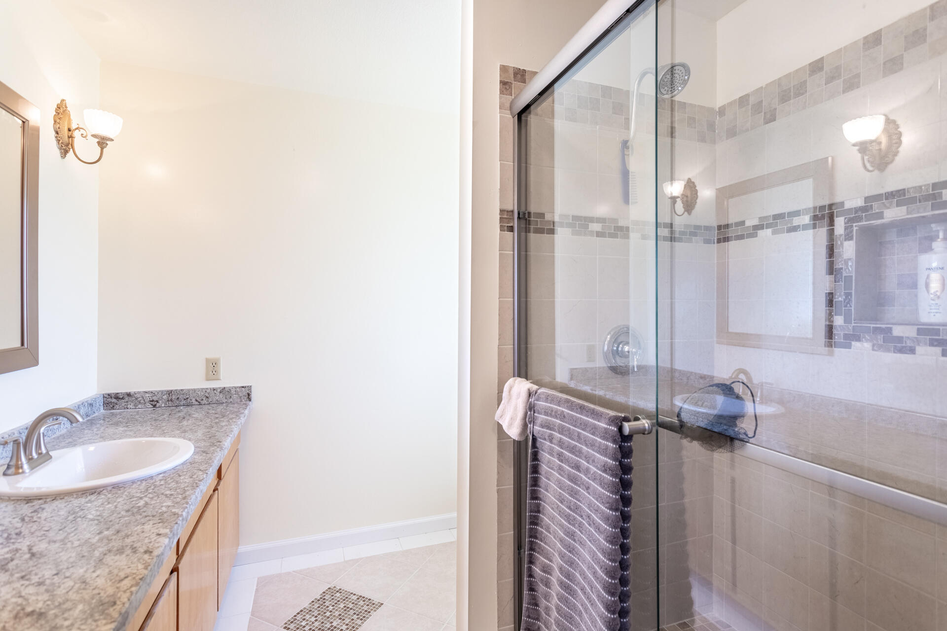 8818 Valley View Road Redding, CA 96001 - Photo 11 of 37 a bathroom with a granite countertop sink and a mirror