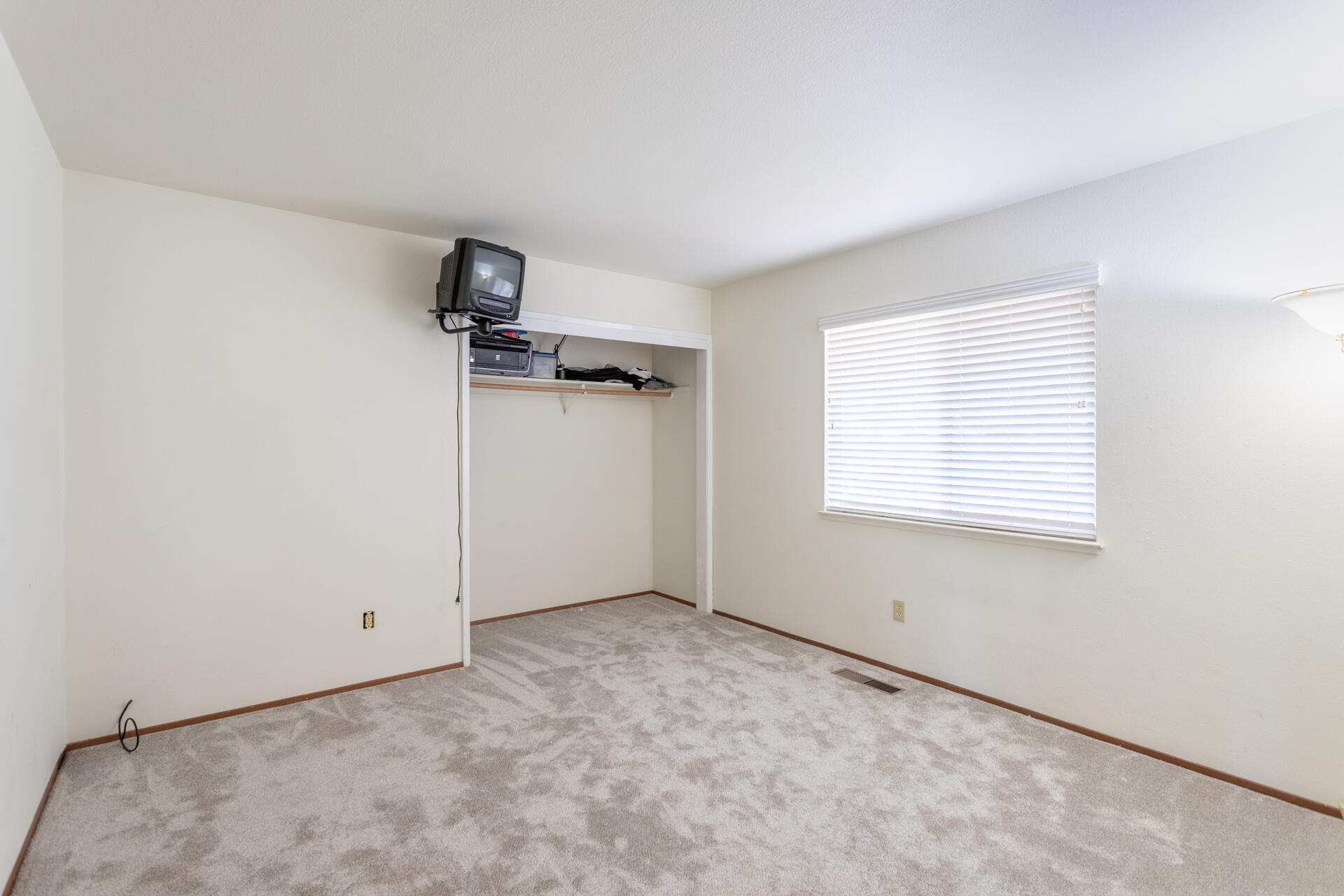 8818 Valley View Road Redding, CA 96001 - Photo 13 of 37 an empty room with windows
