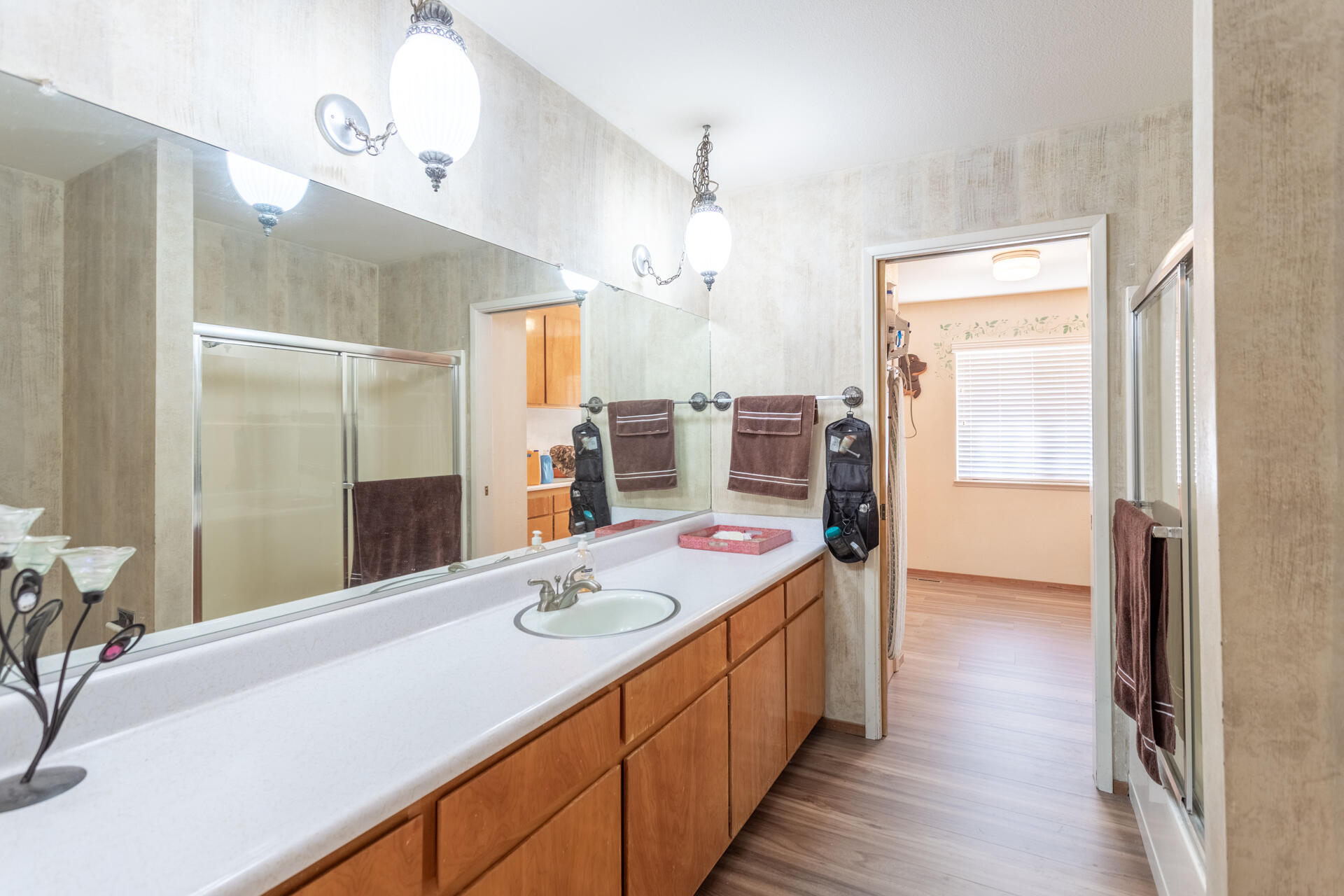 8818 Valley View Road Redding, CA 96001 - Photo 14 of 37 a bathroom with a sink double vanity granite tub and shower