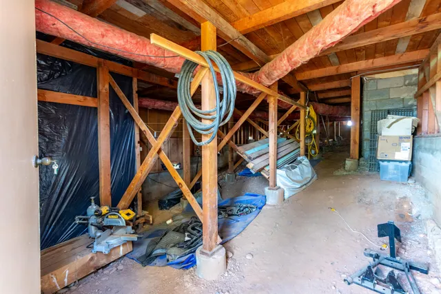 a view of a room with rack and wooden walls