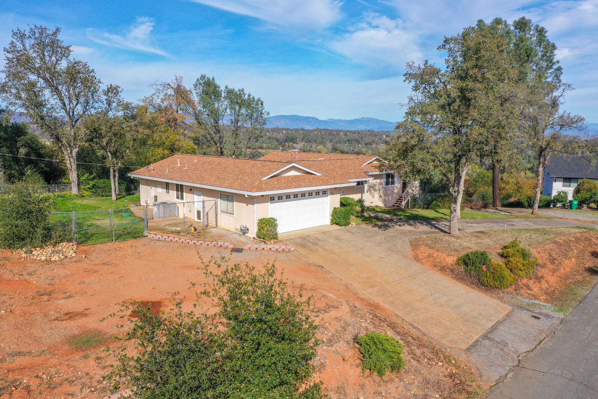 8818 Valley View Road Redding, CA 96001 - Photo 23 of 37 a view of a house with a yard