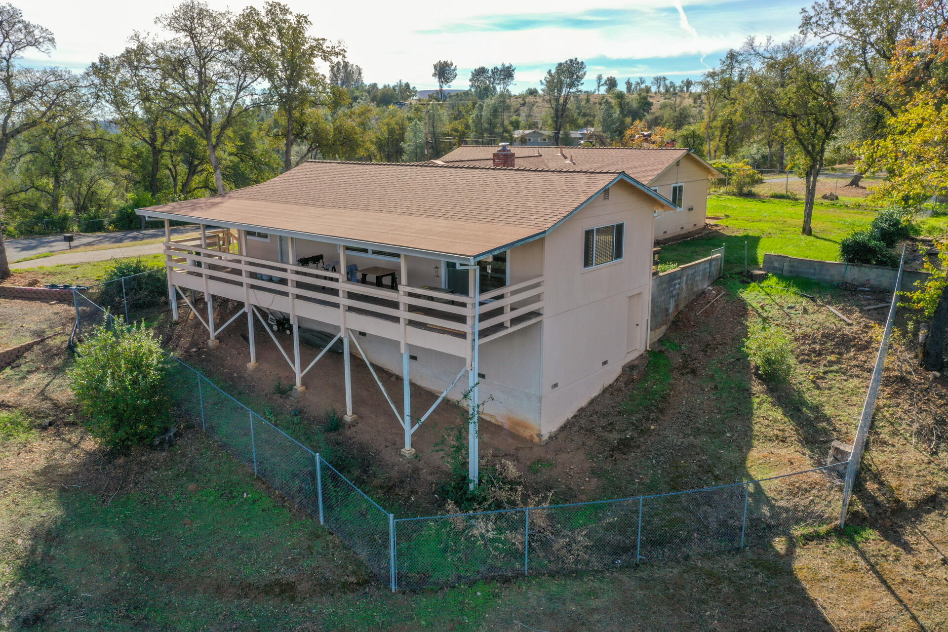 8818 Valley View Road Redding, CA 96001 - Photo 24 of 37 a aerial view of a house with a yard table and chairs