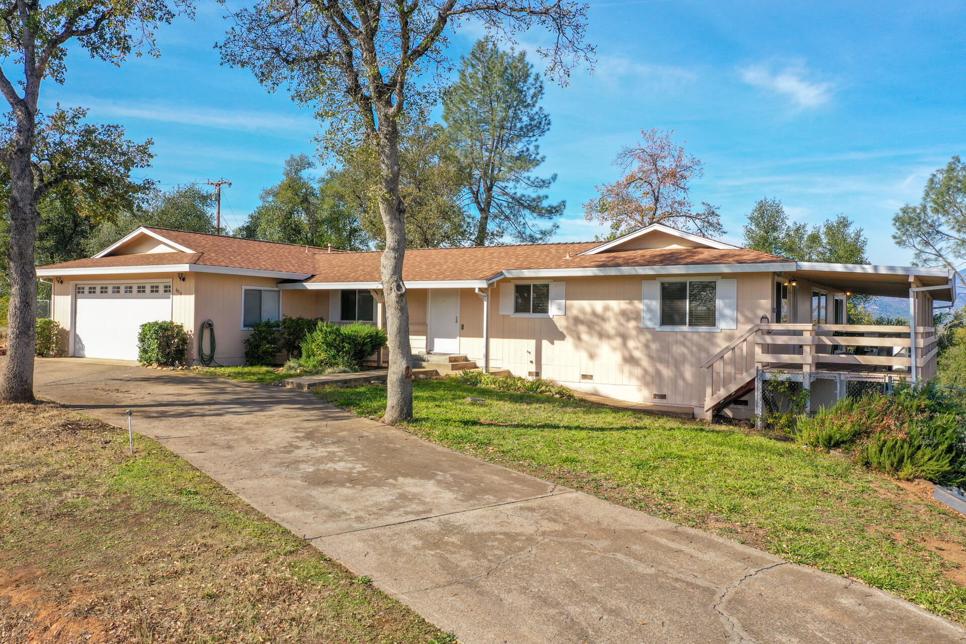 8818 Valley View Road Redding, CA 96001 - Photo 26 of 37 a front view of a house with a yard