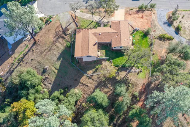 an aerial view of residential house with outdoor space