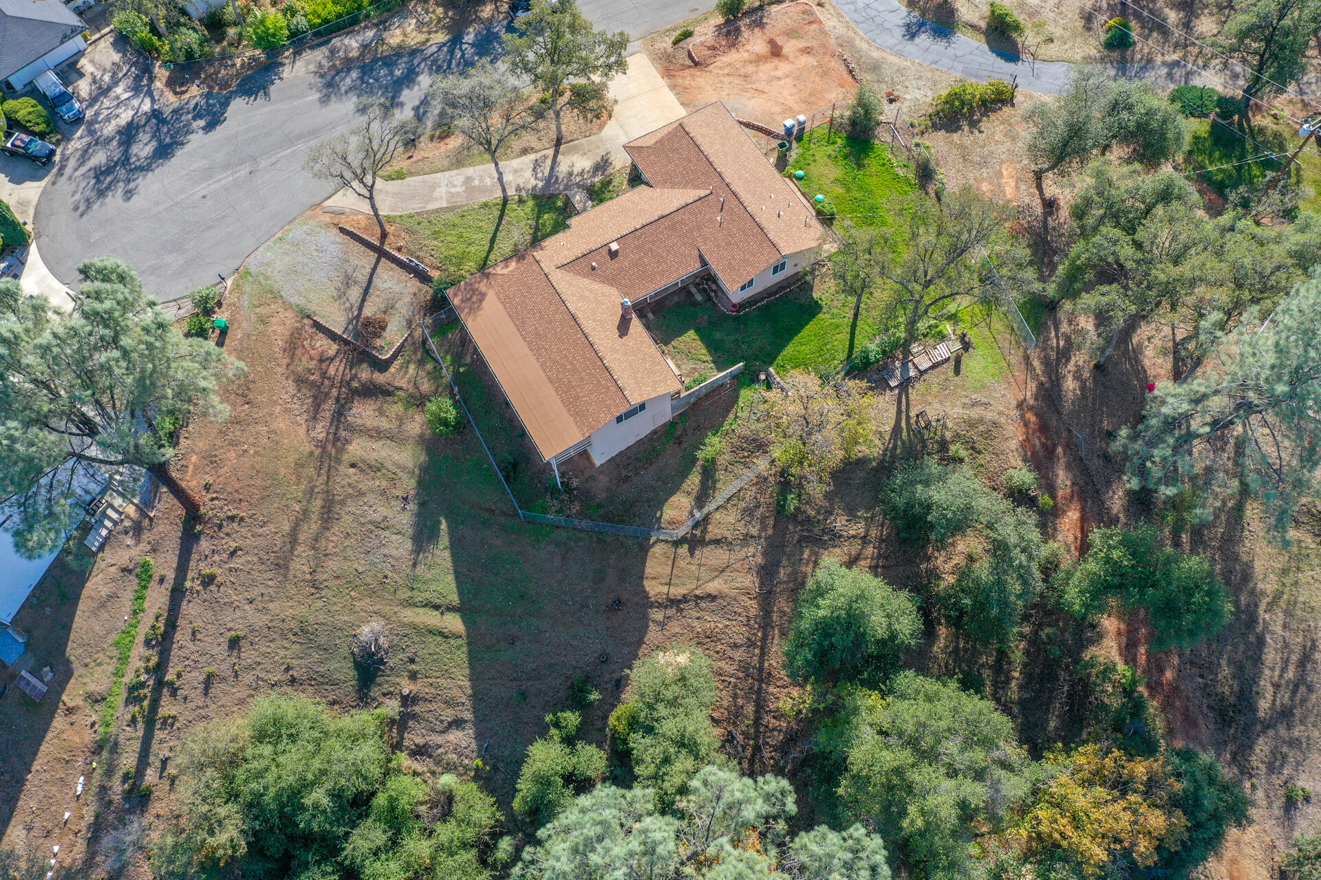 8818 Valley View Road Redding, CA 96001 - Photo 30 of 37 an aerial view of a house with a yard