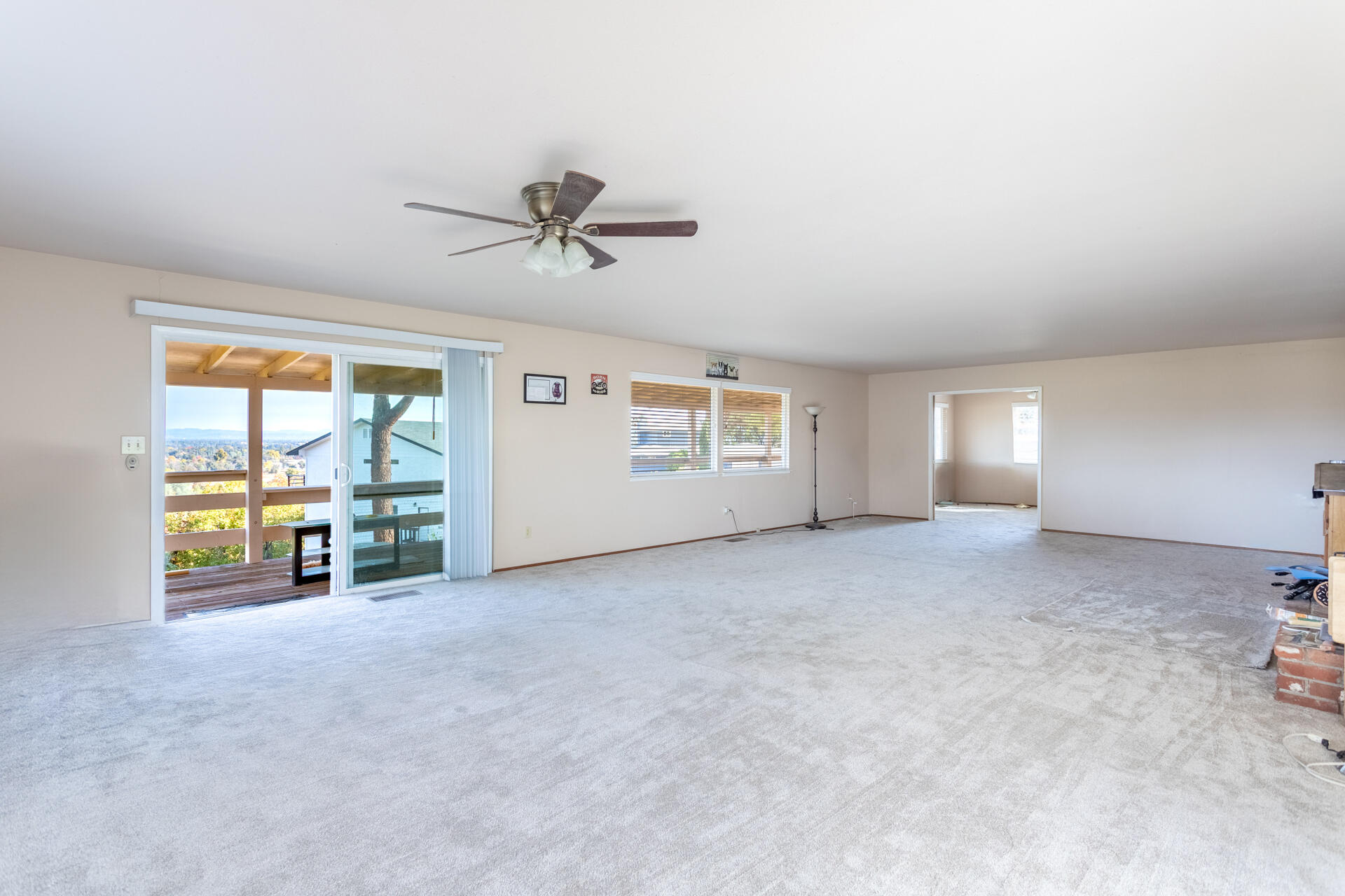 8818 Valley View Road Redding, CA 96001 - Photo 3 of 37 a view of a livingroom with furniture and a ceiling fan