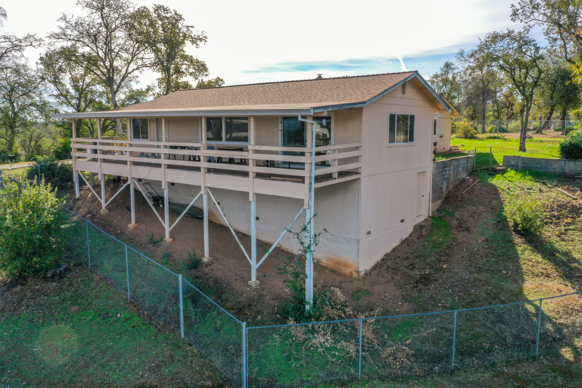 8818 Valley View Road Redding, CA 96001 - Photo 32 of 37 a view of a house with backyard and trees