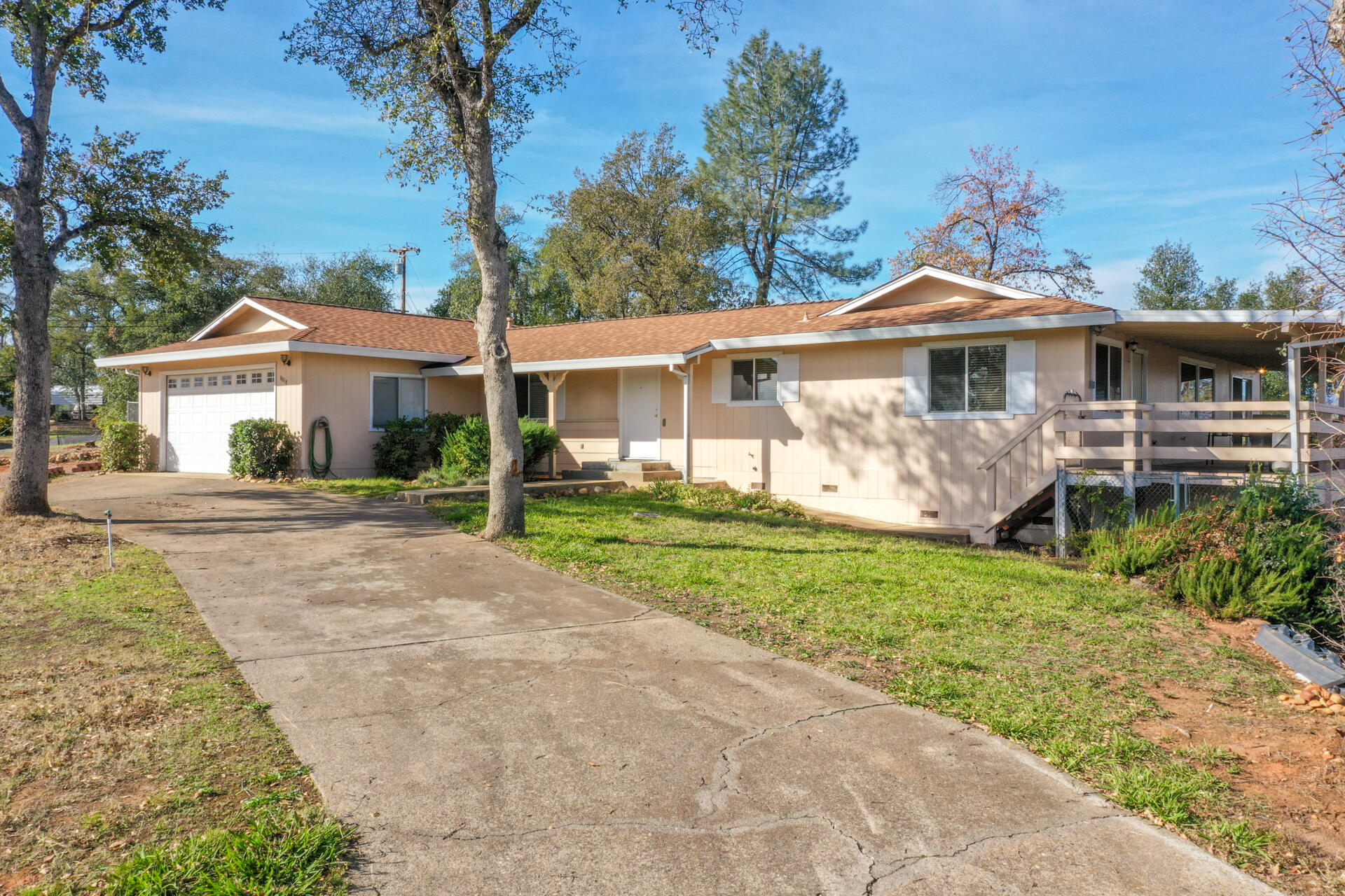 8818 Valley View Road Redding, CA 96001 - Photo 34 of 37 a front view of a house with garden