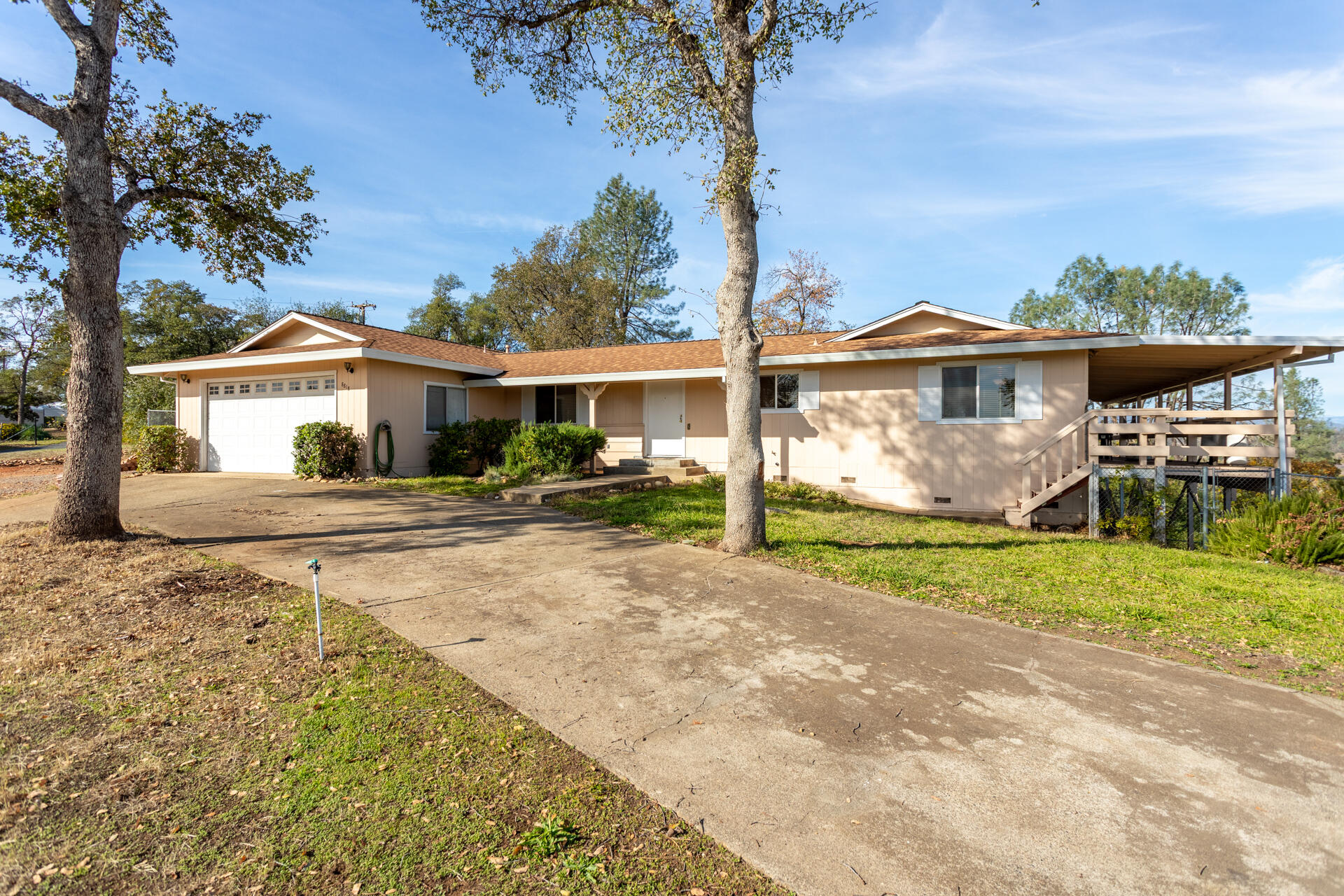 8818 Valley View Road Redding, CA 96001 - Photo 36 of 37 a front view of a house with garden