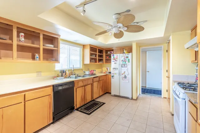 a kitchen with a cabinets and chandelier