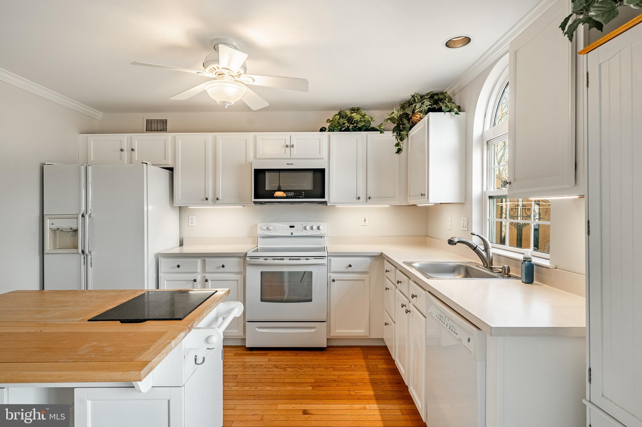 1406 Harbour Ridge Lane Downingtown, PA 19335 - Photo 14 of 57 a kitchen with stainless steel appliances granite countertop a sink stove and refrigerator
