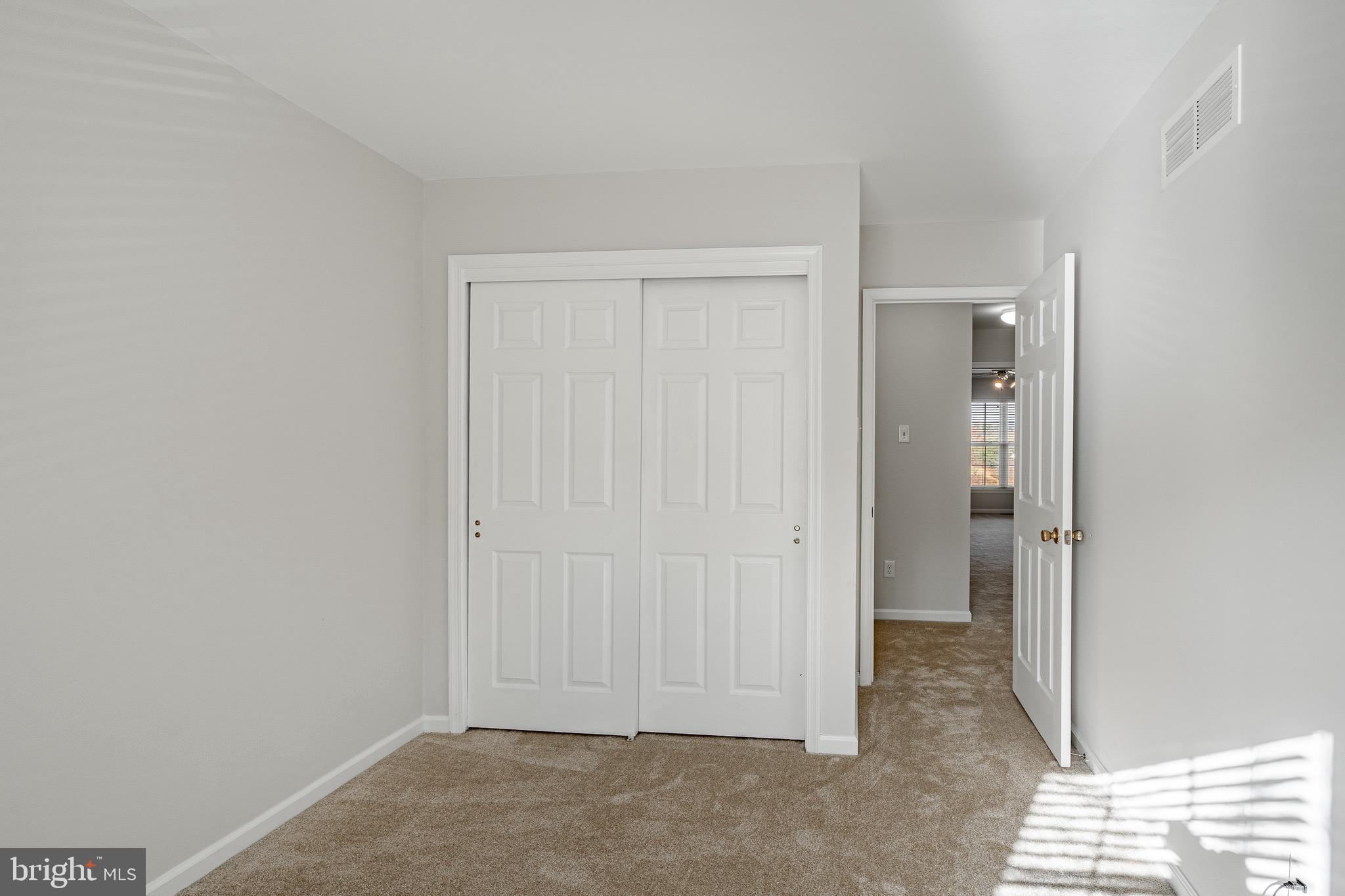 1406 Harbour Ridge Lane Downingtown, PA 19335 - Photo 21 of 57 an empty room with closet