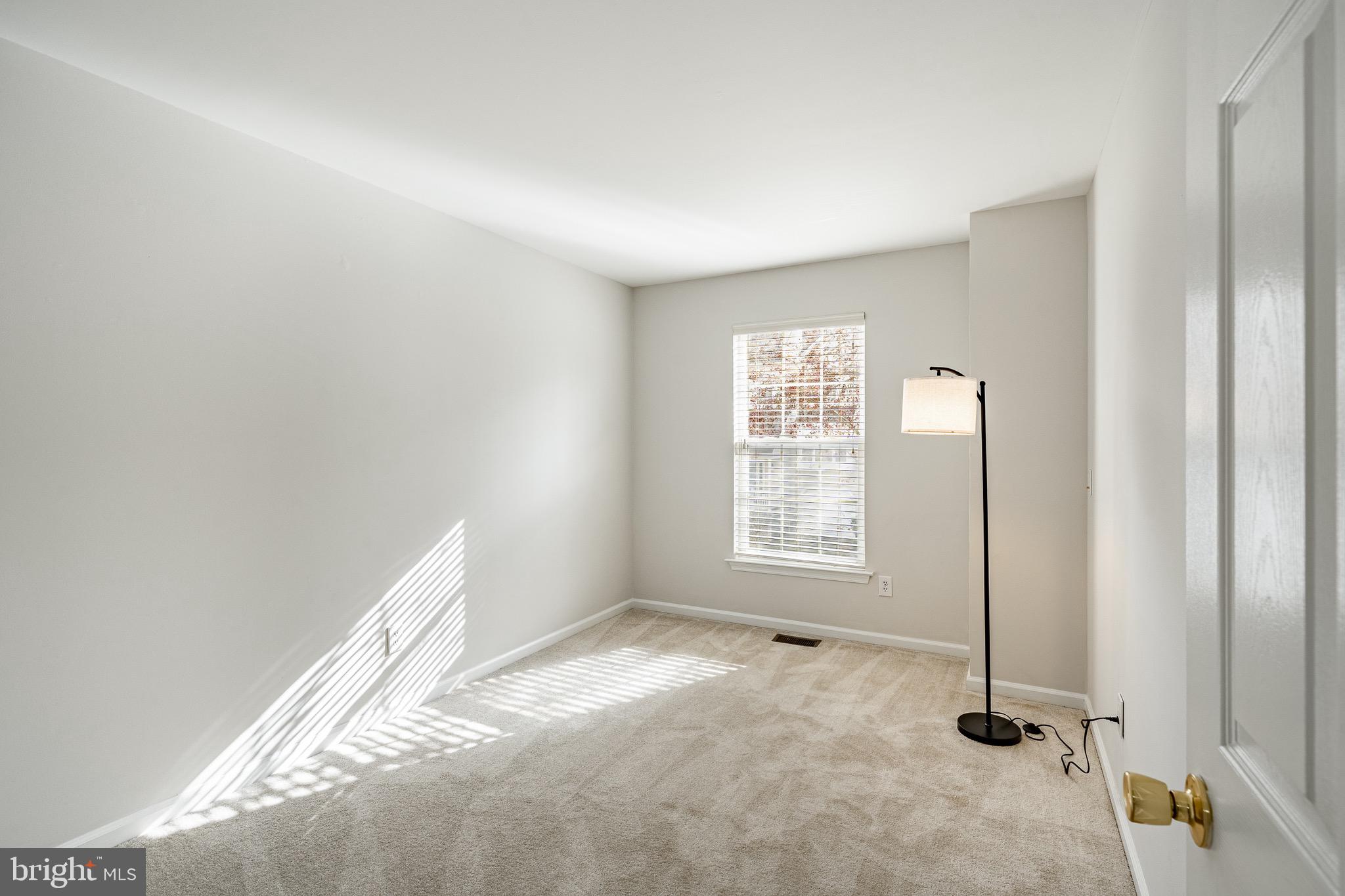 1406 Harbour Ridge Lane Downingtown, PA 19335 - Photo 22 of 57 an empty room with windows