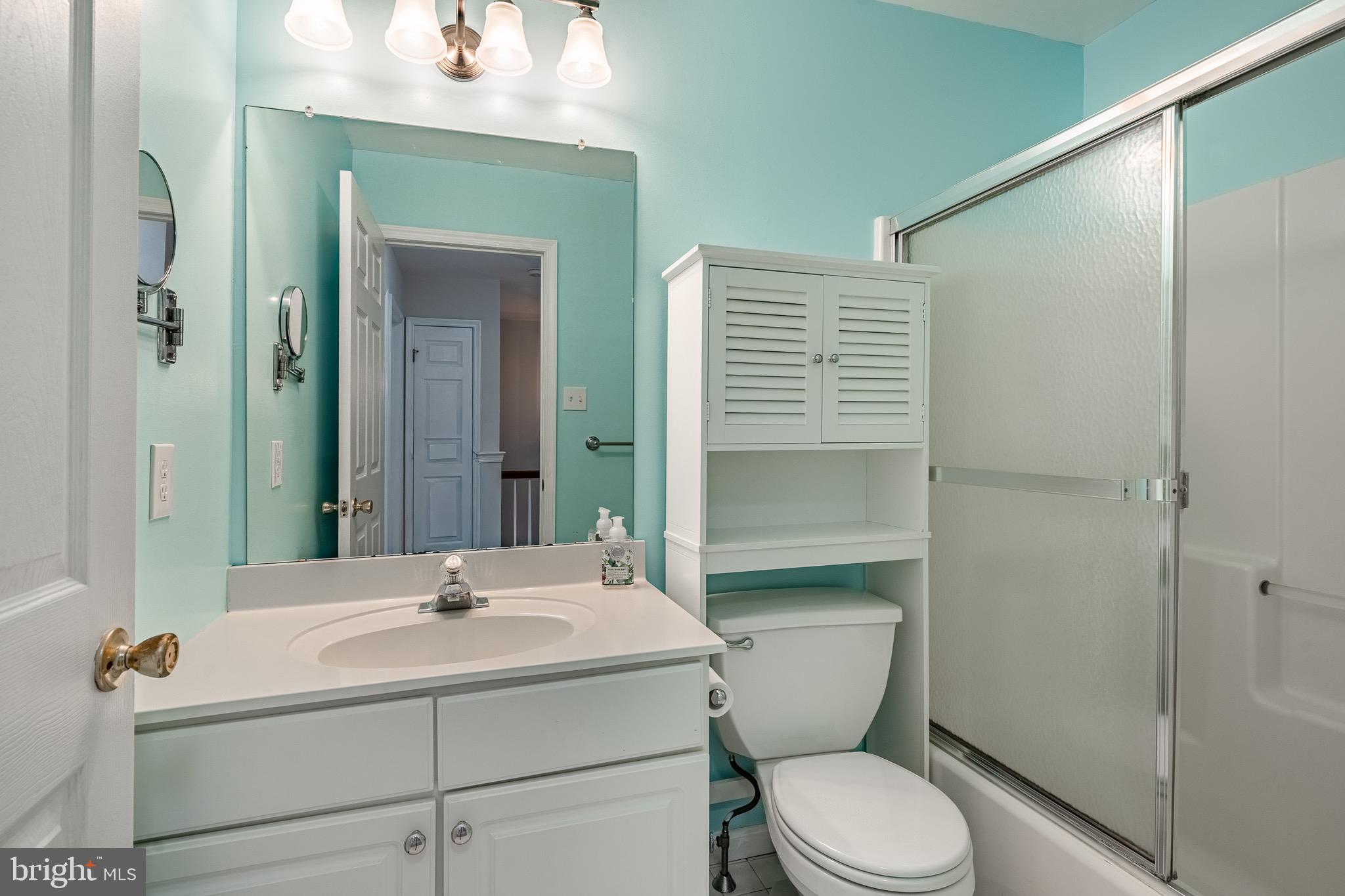 1406 Harbour Ridge Lane Downingtown, PA 19335 - Photo 24 of 57 a bathroom with a sink toilet vanity and shower