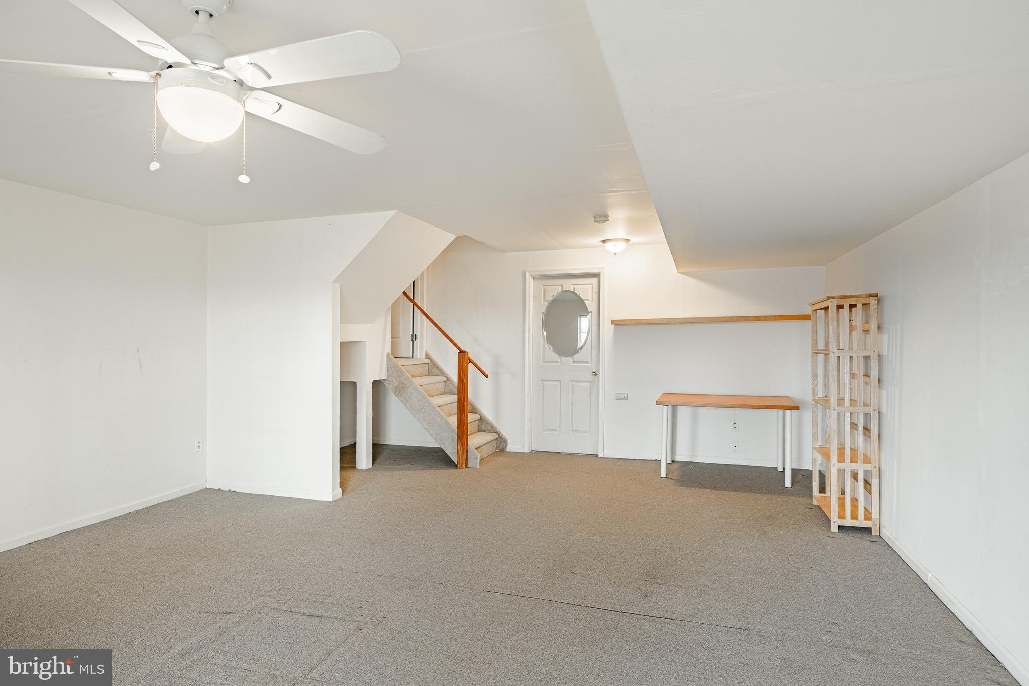 1406 Harbour Ridge Lane Downingtown, PA 19335 - Photo 33 of 57 a view of an empty room with a ceiling fan