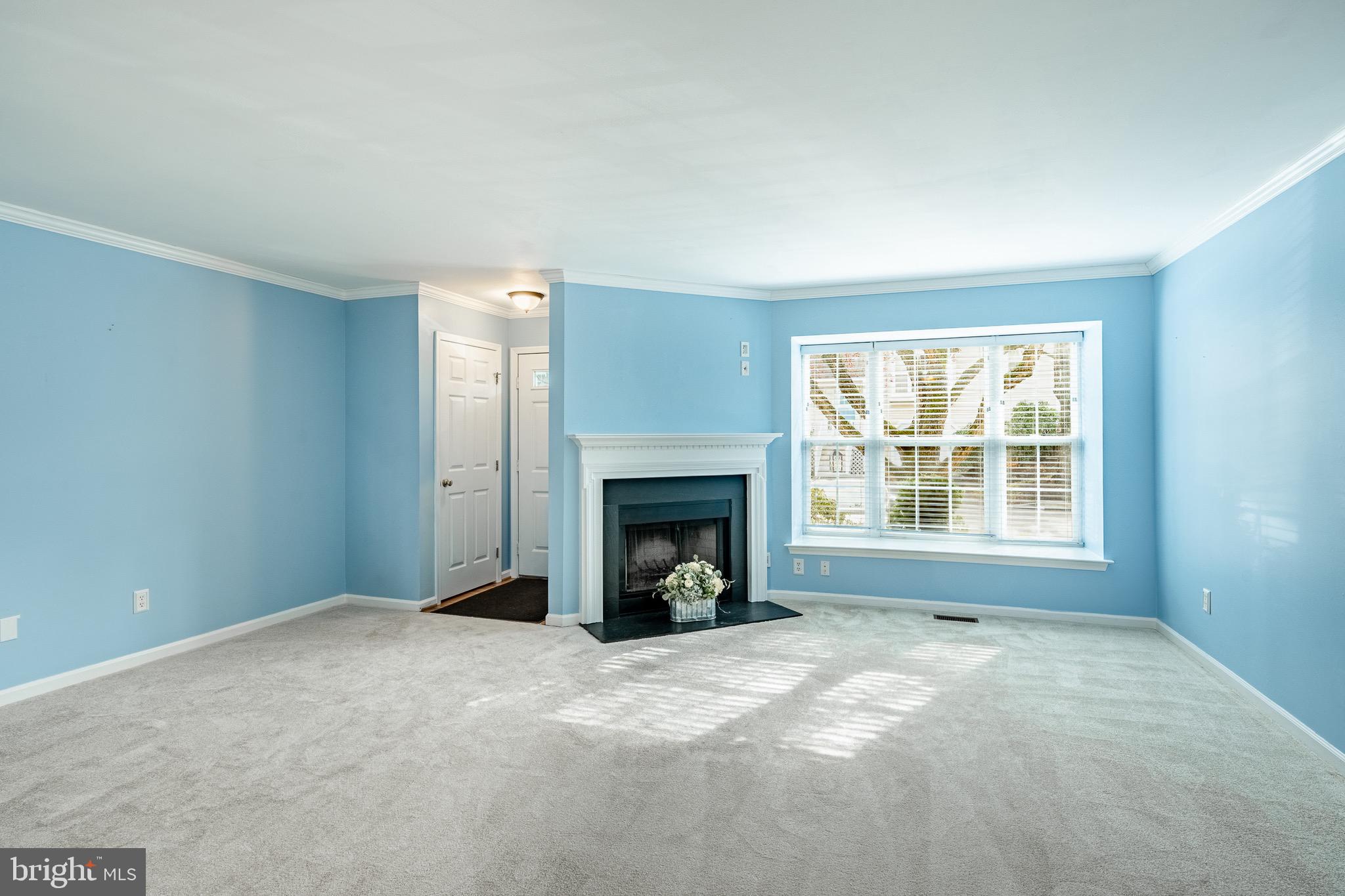 1406 Harbour Ridge Lane Downingtown, PA 19335 - Photo 8 of 57 a view of a livingroom with a fireplace and window