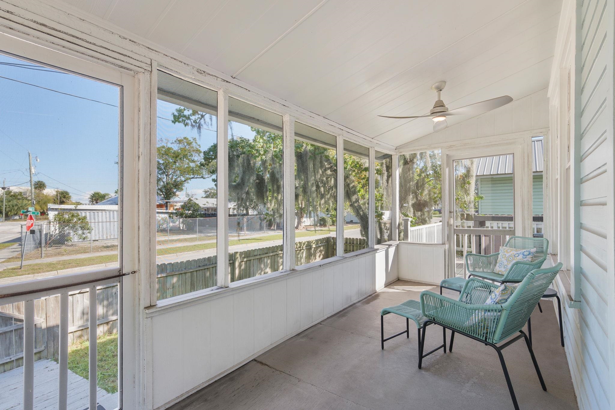 2 Clark Street St. Augustine, FL 32084 - Photo 2 of 39 a living room with furniture and a floor to ceiling window