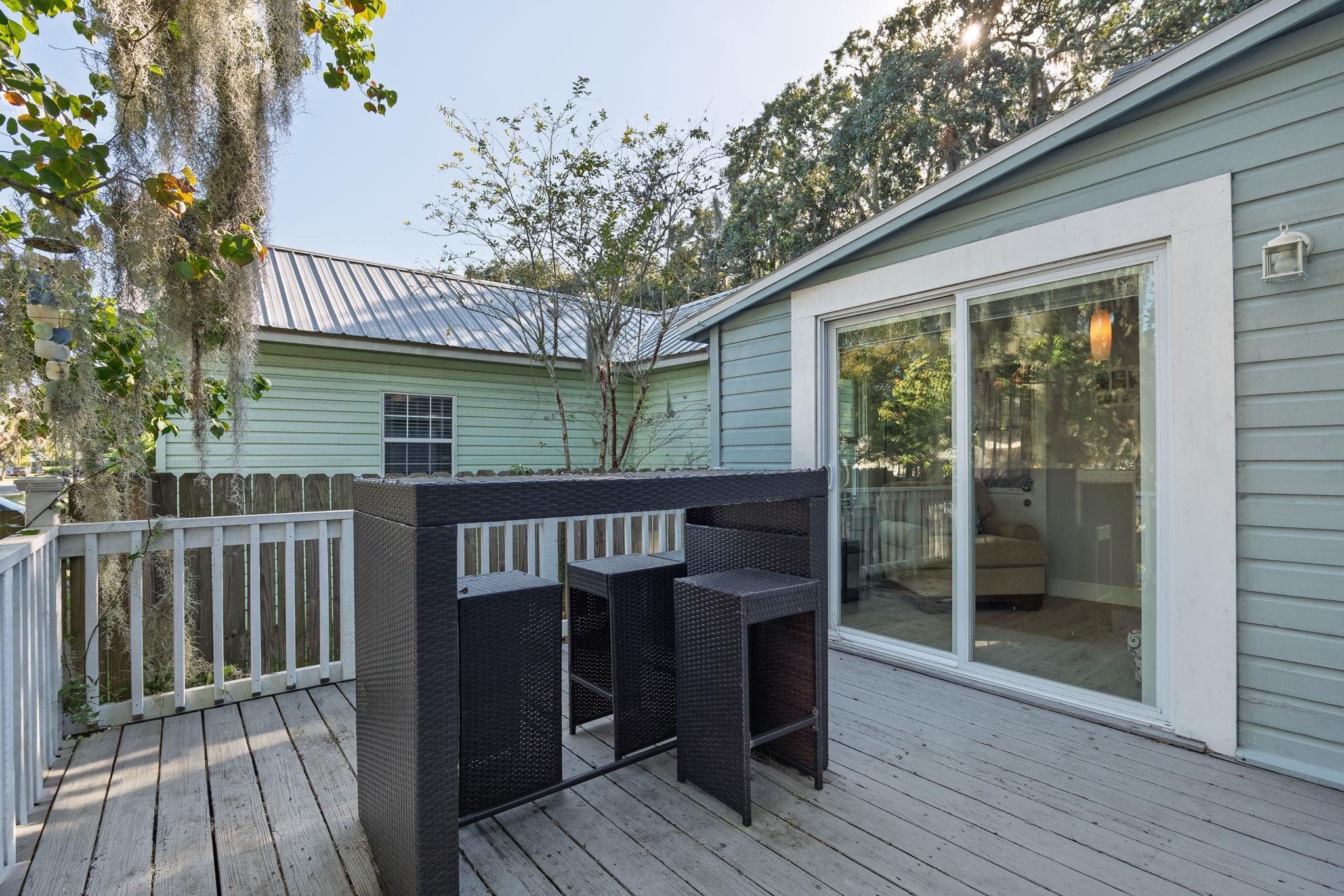 2 Clark Street St. Augustine, FL 32084 - Photo 27 of 39 a view of a balcony dining area and wooden deck
