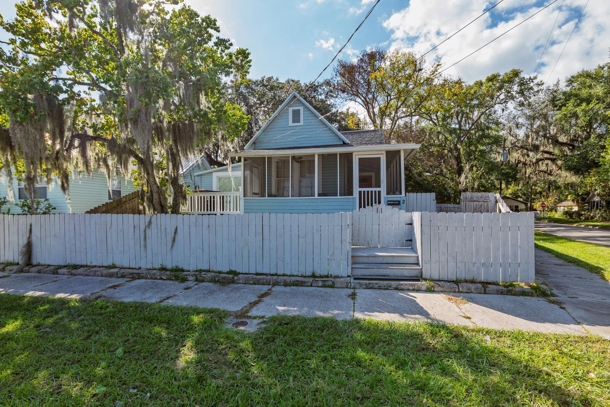 2 Clark Street St. Augustine, FL 32084 - Photo 36 of 39 a front view of a house with a yard and trees