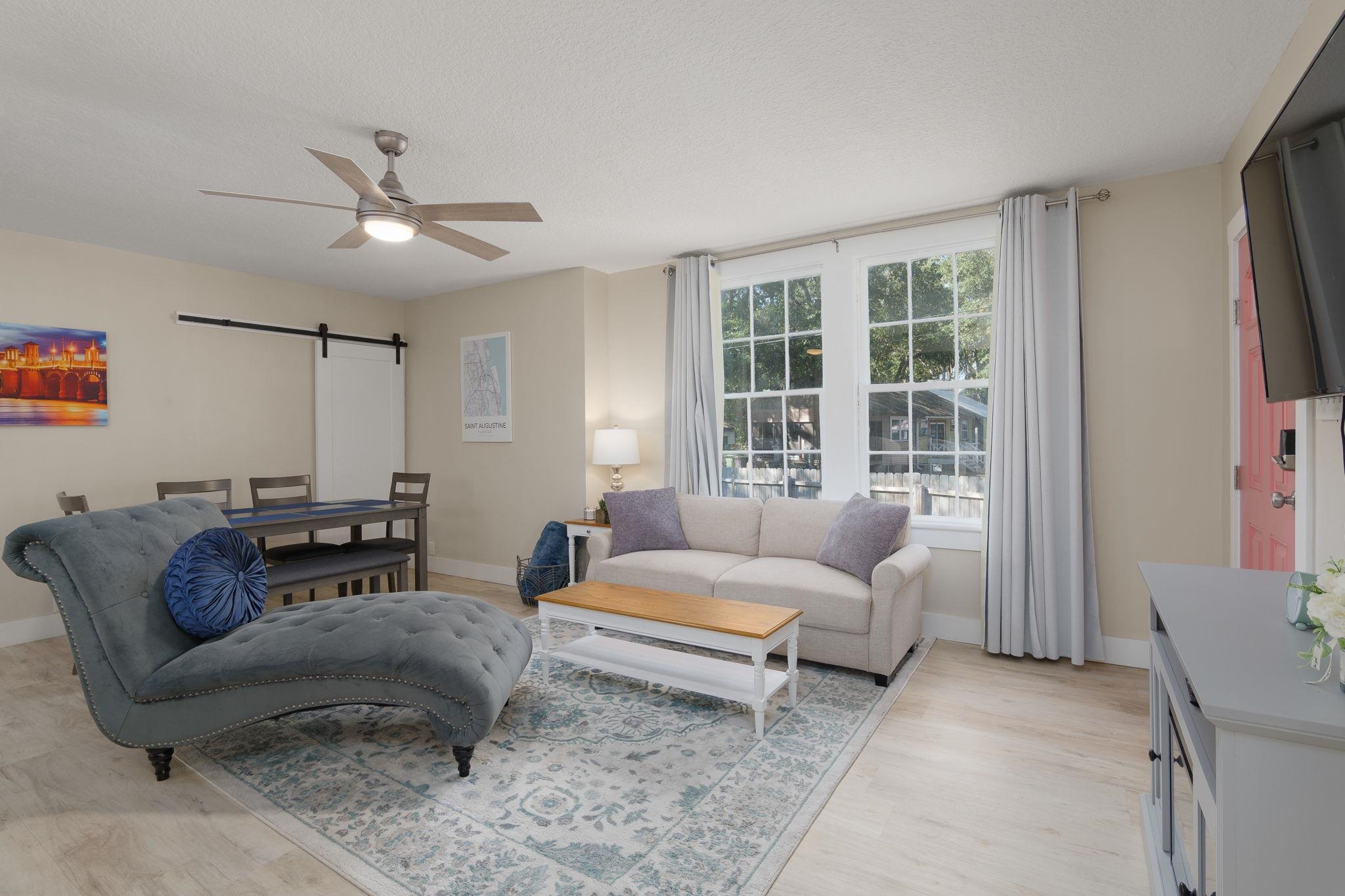 2 Clark Street St. Augustine, FL 32084 - Photo 5 of 39 a living room with furniture and a large window