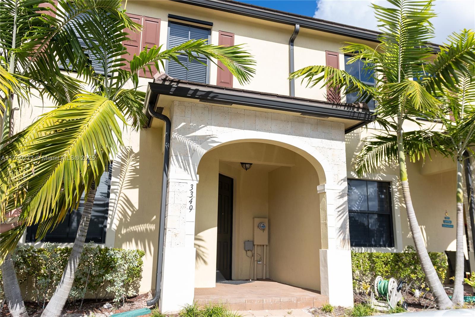 3349 West 105th Terrace, Unit 3349 Hialeah, FL 33018 - Photo 1 of 11 a view of a house with a small entryway