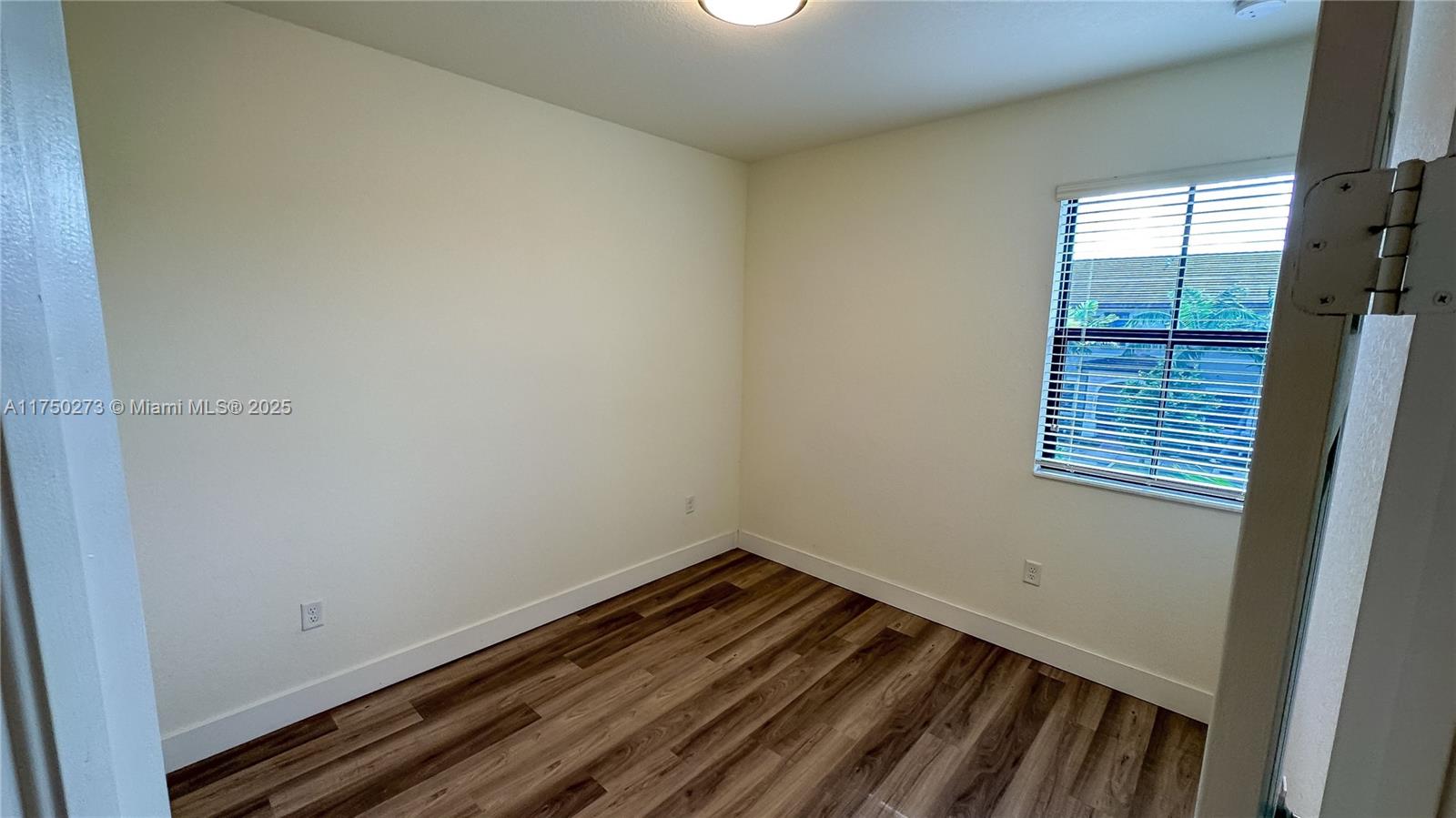 3349 West 105th Terrace, Unit 3349 Hialeah, FL 33018 - Photo 7 of 11 a room with a window