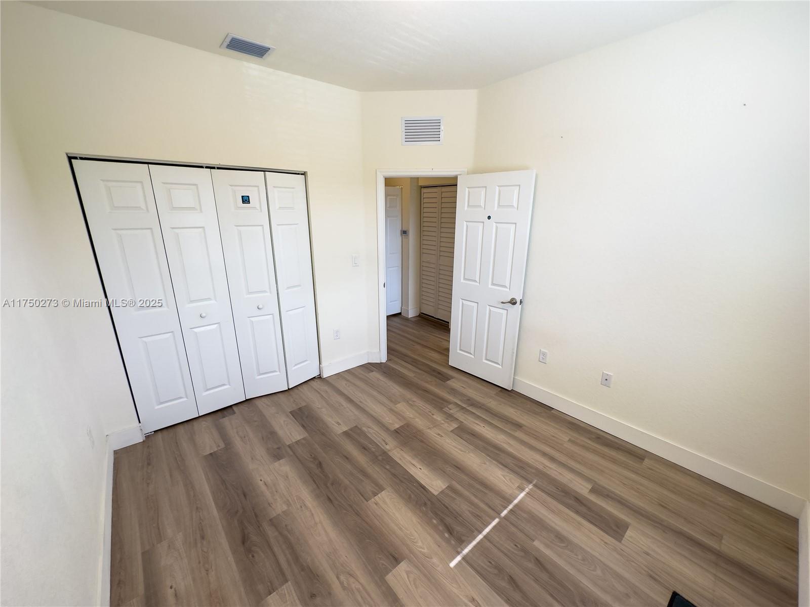 3349 West 105th Terrace, Unit 3349 Hialeah, FL 33018 - Photo 8 of 11 a view of an empty room