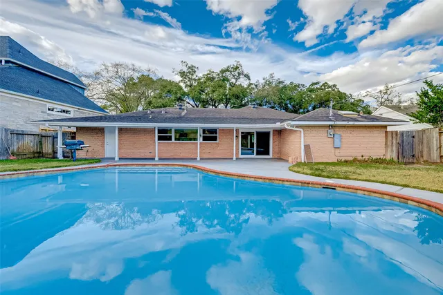a view of a house with a swimming pool