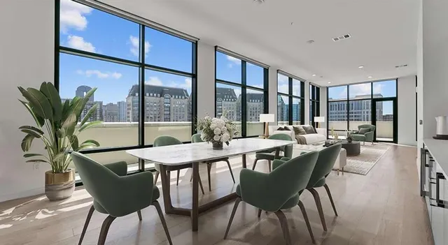 a view of a dining room with furniture window and outside view