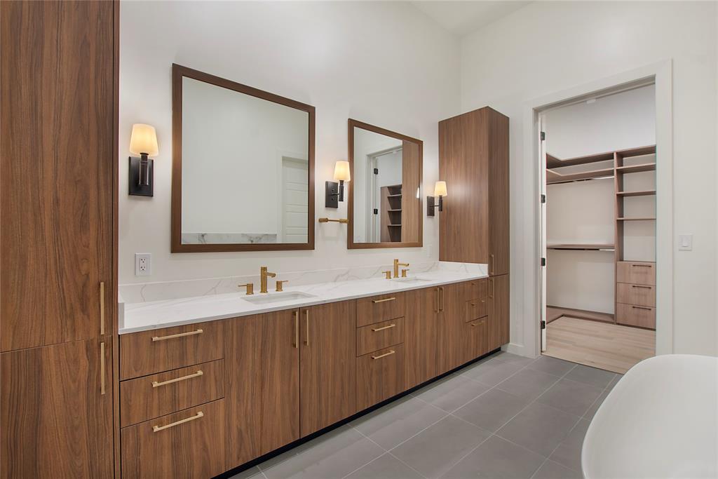 2620 Maple Avenue, Unit 1101 Dallas, TX 75201 - Photo 15 of 39 a bathroom with a double vanity sink and mirror